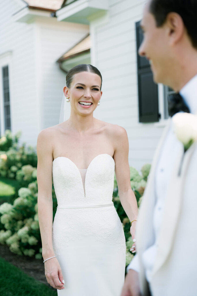 Bride and groom walking together after their first look in Bedford