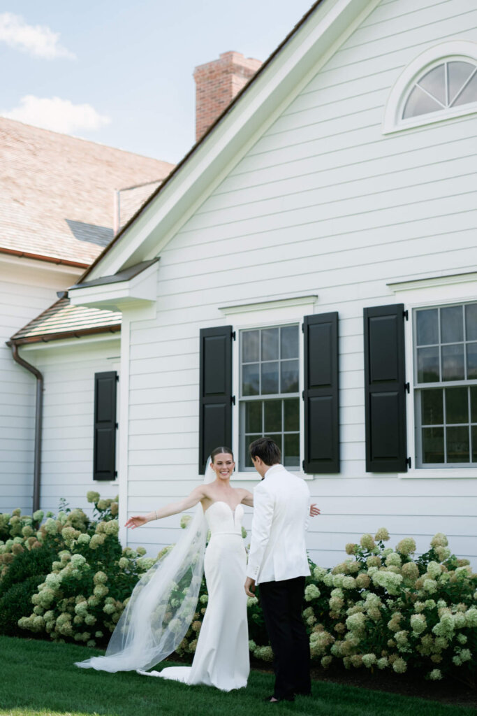 Bride and groom smiling together before the ceremony at Bedford Golf and Tennis Club