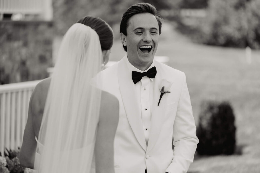 Bride and groom portrait on the lawn outside Bedford Golf and Tennis Club