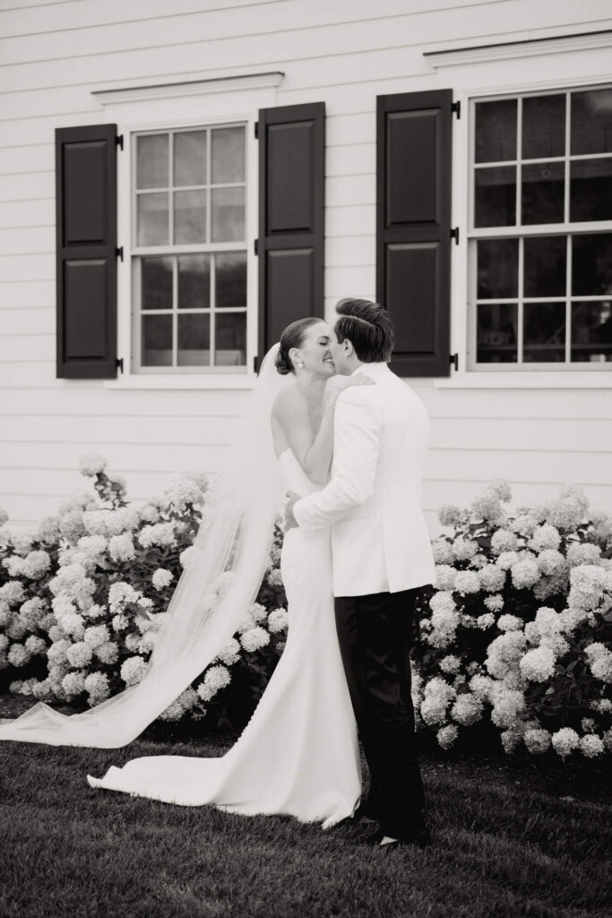 Bride and groom holding hands before their Bedford wedding ceremony