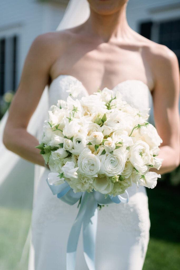 Bride and groom portrait with blue and white flowers before the Bedford ceremony