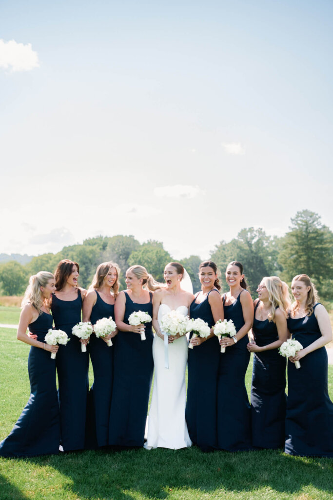 Bridesmaids in blue dresses at a Bedford Golf and Tennis Club wedding