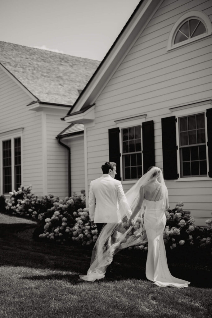White ceremony aisle with blue and white flowers at Bedford Golf and Tennis Club