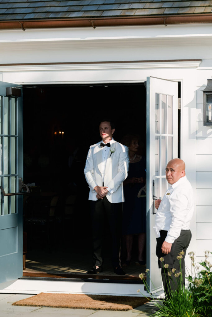 Groom waiting outside before the Bedford Golf and Tennis Club ceremony