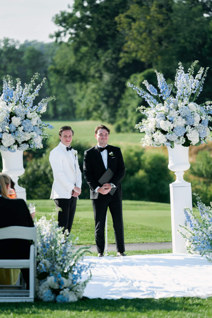 Groom and officiant at the ceremony altar at Bedford Golf and Tennis Club