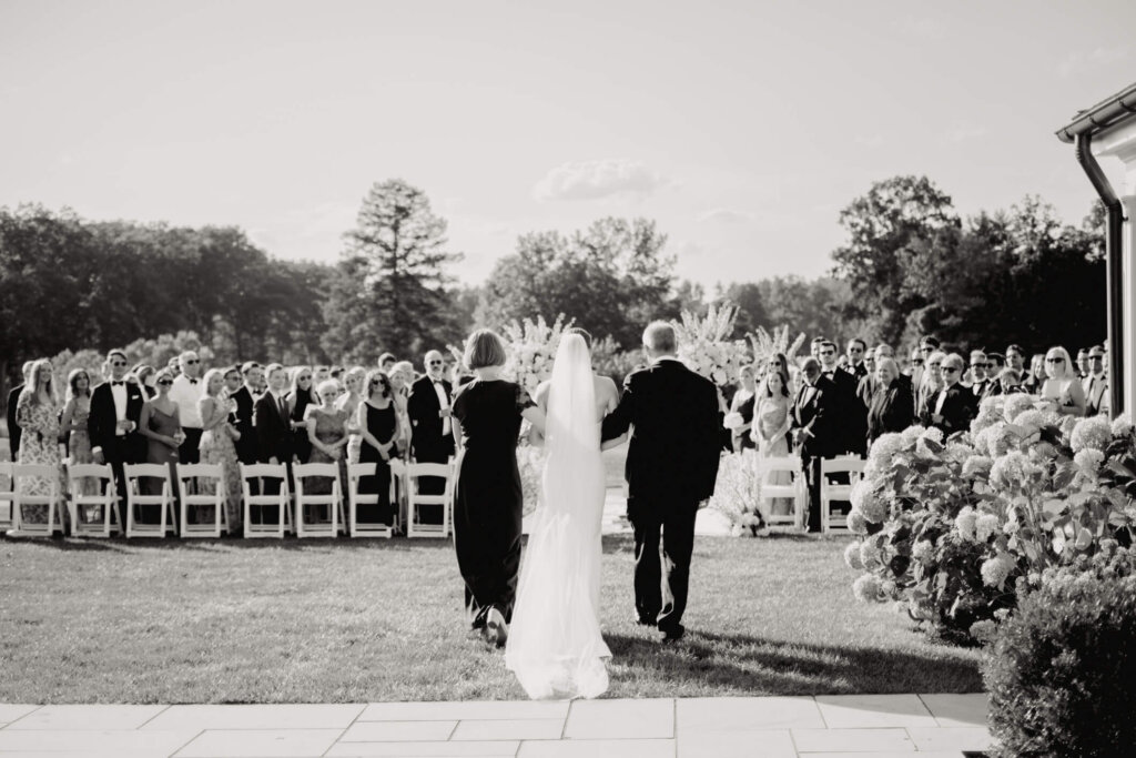 Black and white view of the bride entering the ceremony in Bedford, New York