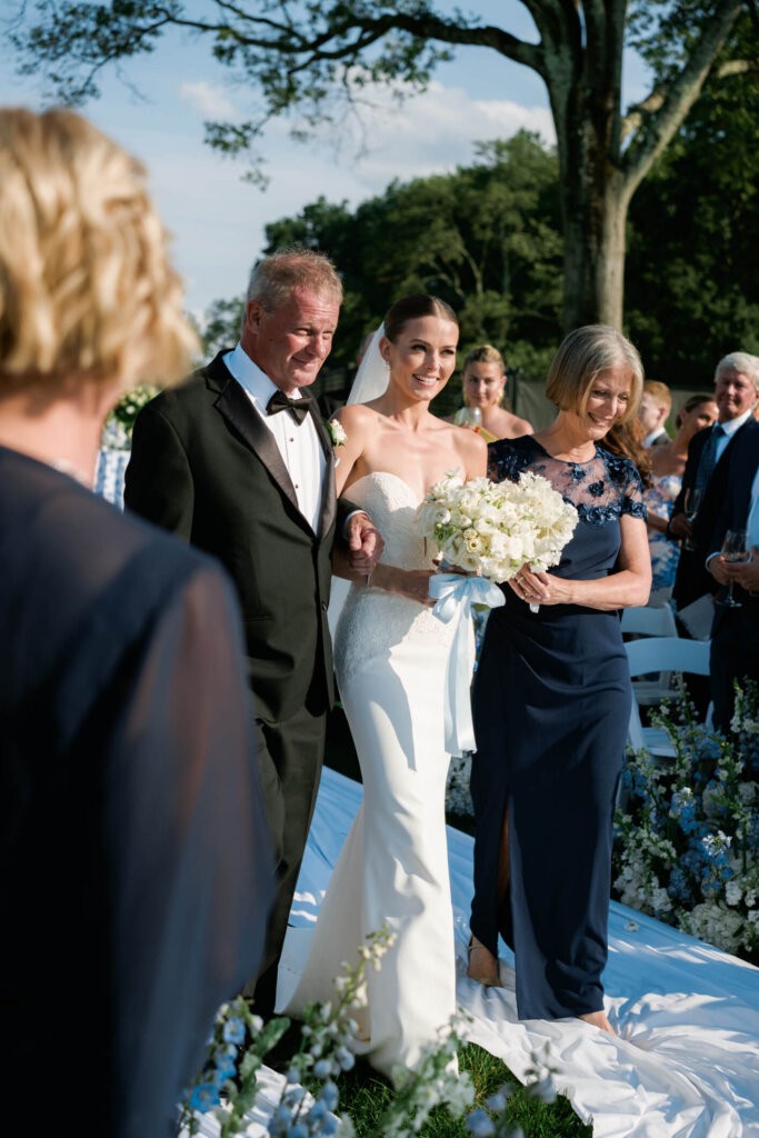 Bride walking down the aisle at Bedford Golf and Tennis Club in Bedford, New York