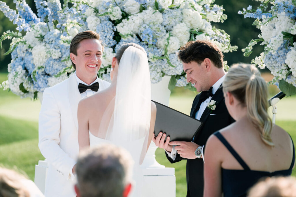 Bride and groom at the altar during their Bedford Golf and Tennis Club wedding