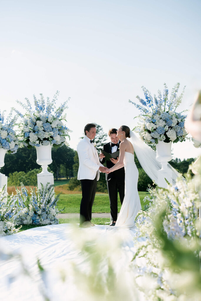 Wide view of vows at the Bedford Golf and Tennis Club outdoor ceremony
