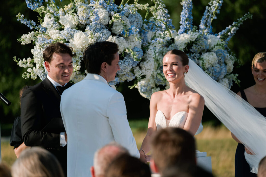 Bride and groom exchanging vows at Bedford Golf and Tennis Club