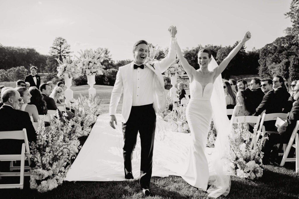 Bride and groom celebrating after the ceremony in Bedford, New York