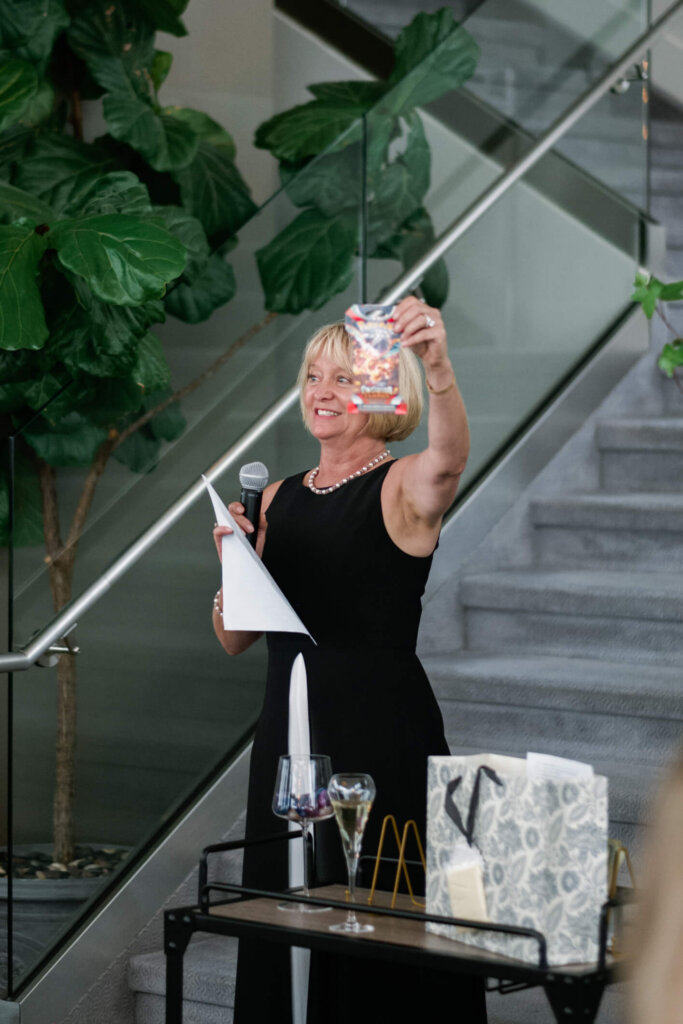 Guest raising a toast during the New York welcome dinner before the Bedford wedding