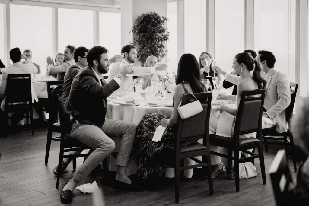 Guests dining together at Louise and James’ New York welcome dinner