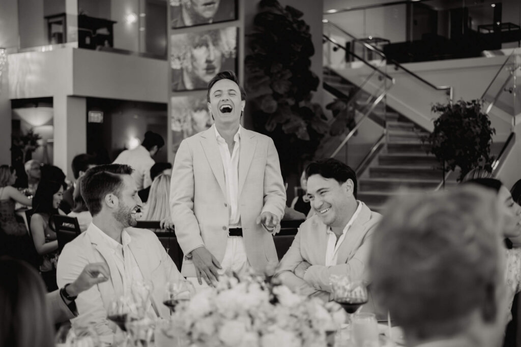 Guest giving a speech during Louise and James’ New York welcome dinner