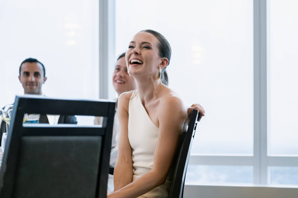 Louise laughing during the New York welcome dinner before the Bedford wedding weekend