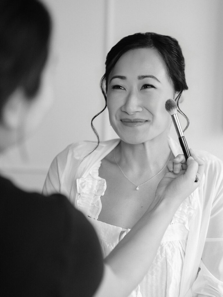 Tiffany having her wedding makeup applied at Thompson Washington DC
