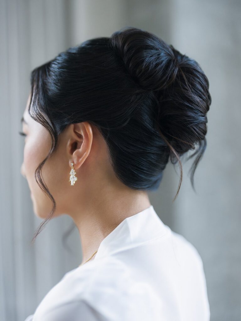 Tiffany's wedding updo and pearl drop earrings