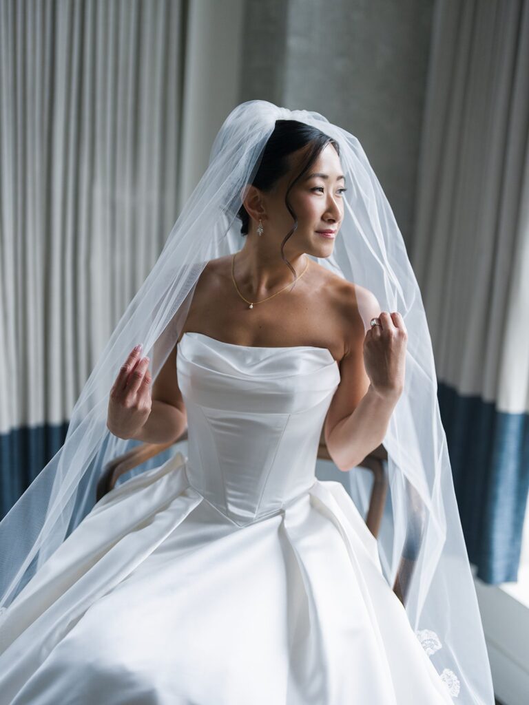 Tiffany wearing her lace-edged veil before leaving for the ceremony