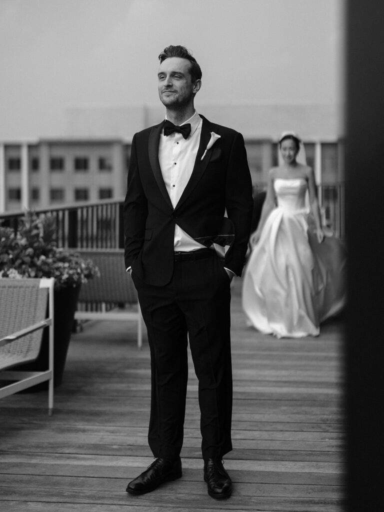 Tim waiting for Tiffany on a Navy Yard terrace before their first look