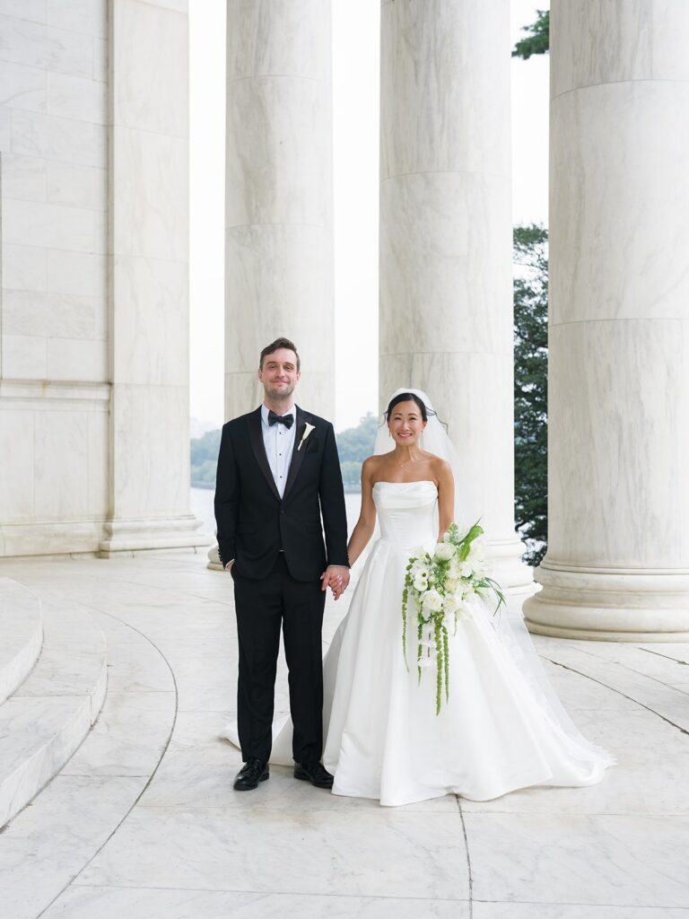 Tiffany and Tim standing between the marble columns of the Jefferson Memorial