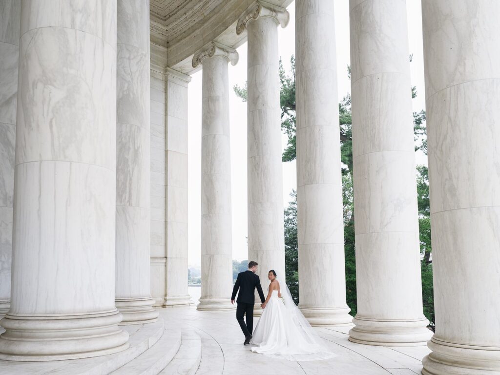 Tiffany and Tim walking through the Jefferson Memorial columns
