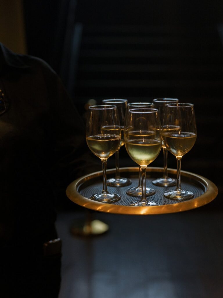 Tray of white wine served before the District Winery ceremony