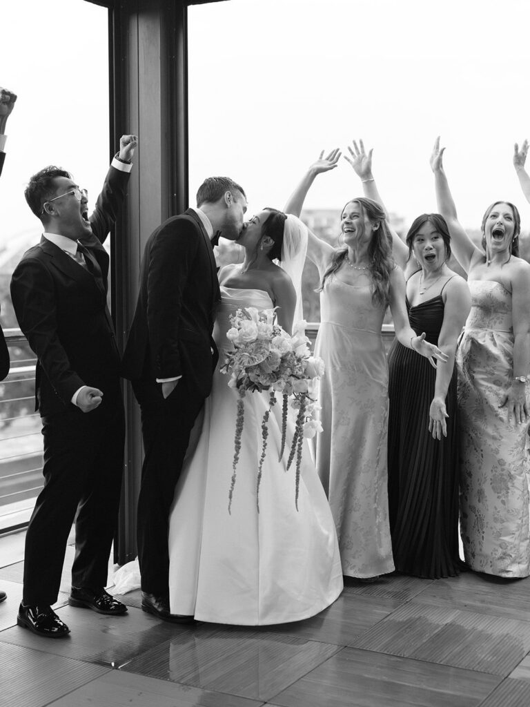 Tiffany and Tim celebrating with their wedding party at District Winery