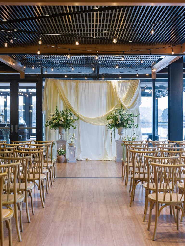 Wedding ceremony aisle and floral installation at District Winery