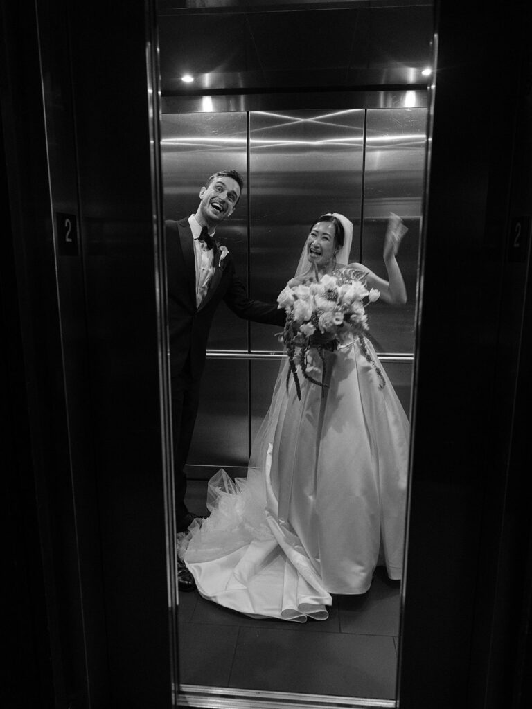 Tiffany and Tim celebrating together in the District Winery elevator