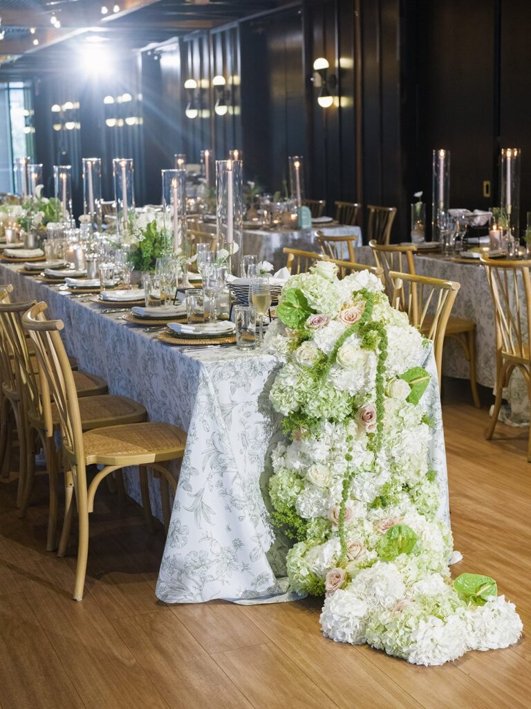 Green-and-white sweetheart table floral installation at District Winery