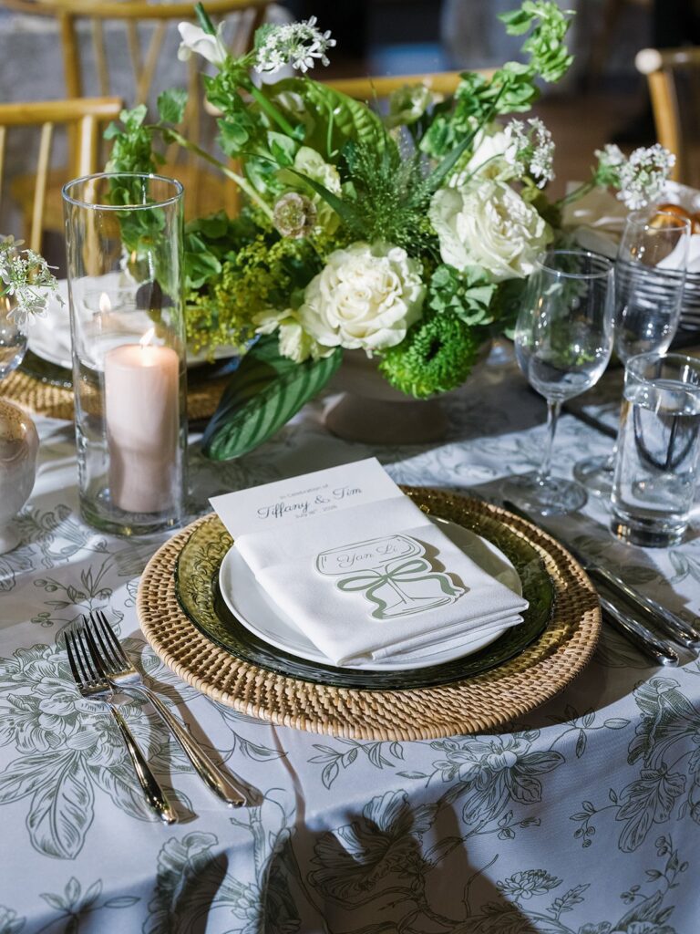 District Winery place setting with green glass plate and woven charger