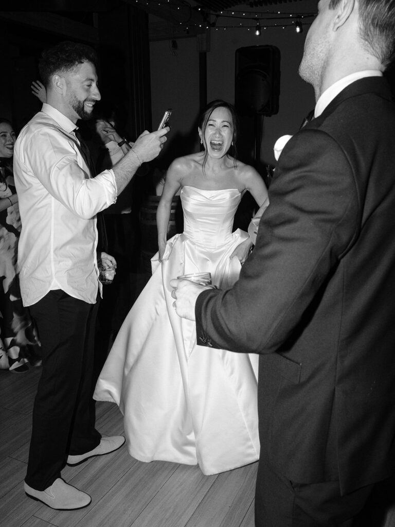 Tiffany laughing with guests on the District Winery dance floor