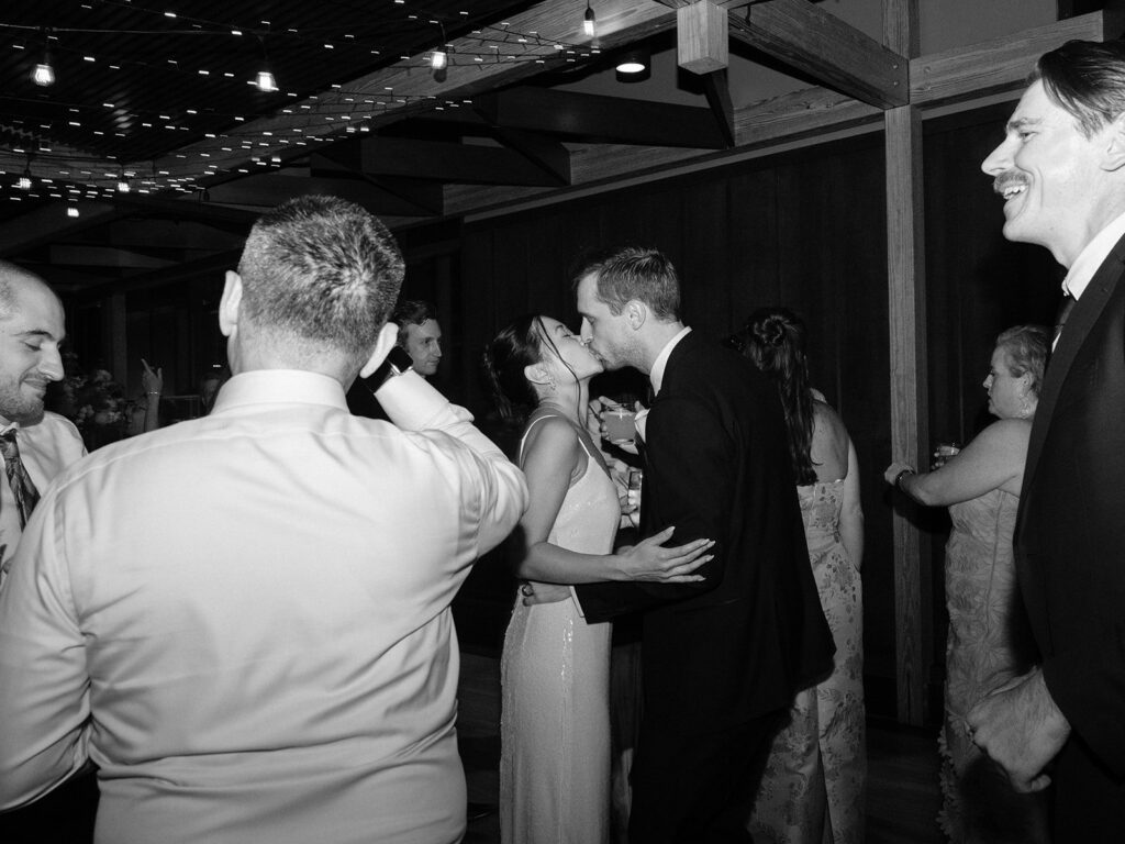 Guests dancing under string lights at District Winery