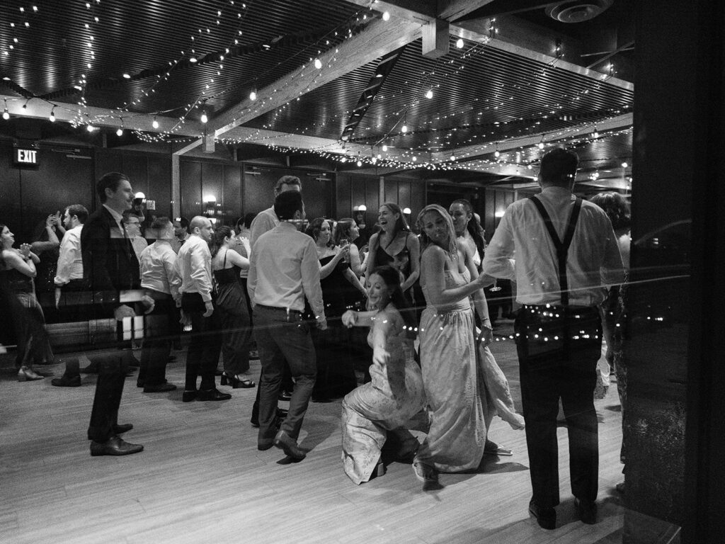 Wide black-and-white view of the District Winery dance floor