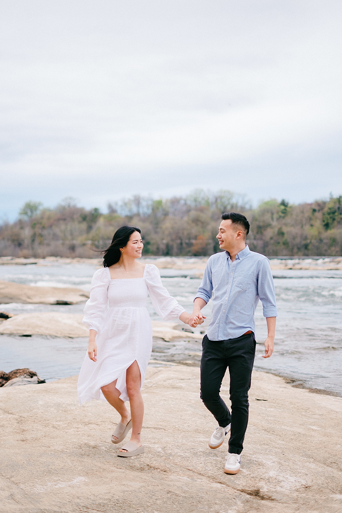 couple walking on the rocks at Belle Isle in Richmond, Virginia