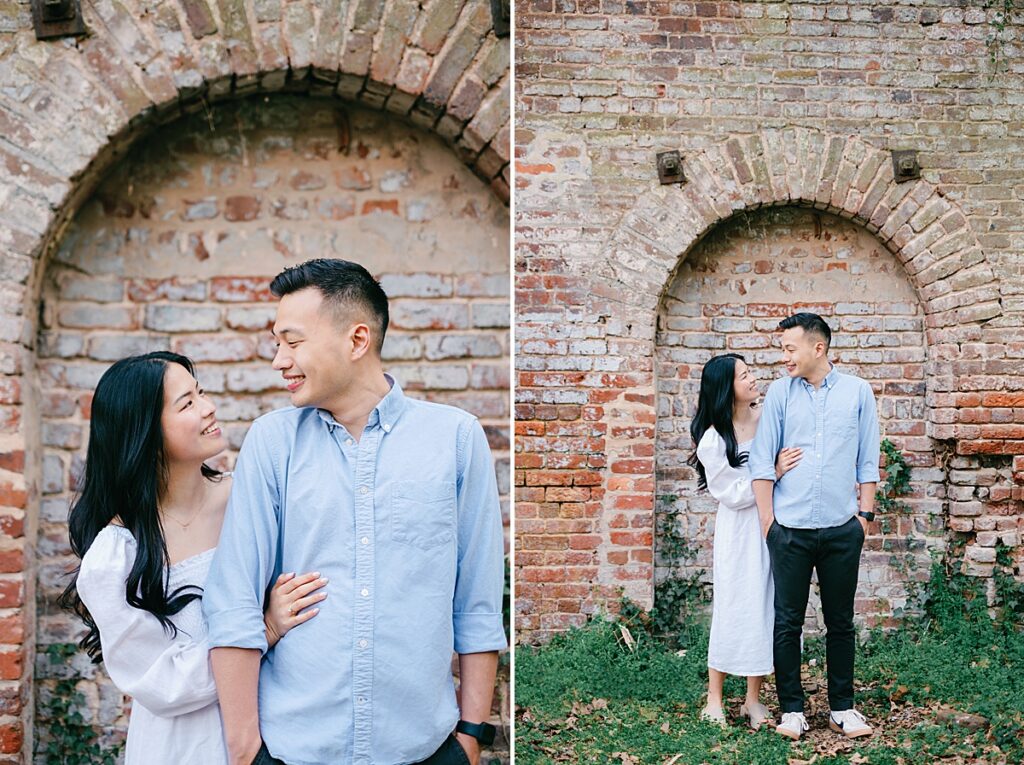 couple in front of brick wall on belle isle