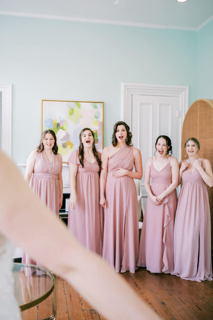 Bride first look with bridesmaids at the Merrimon-Wynne House in Raleigh, NC.