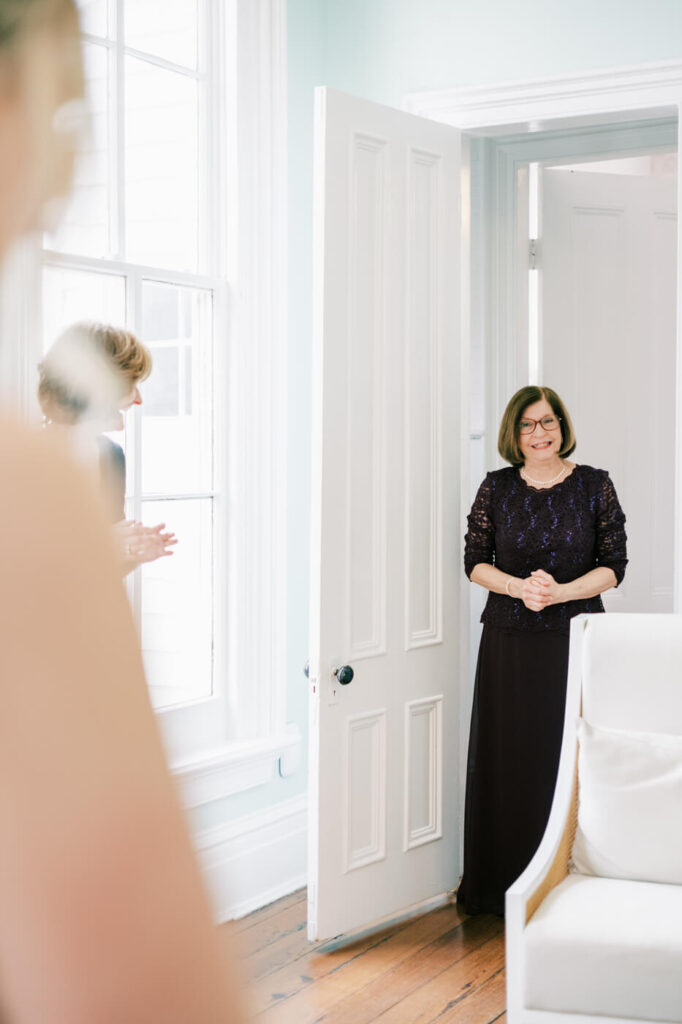 Bride first look with mother-in-law at the Merrimon-Wynne House in Raleigh, NC.