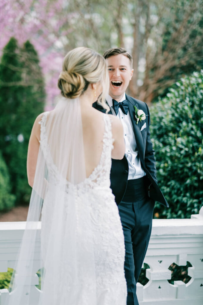 Bride and groom first look on the porch at the Merrimon-Wynne House in Raleigh, NC.