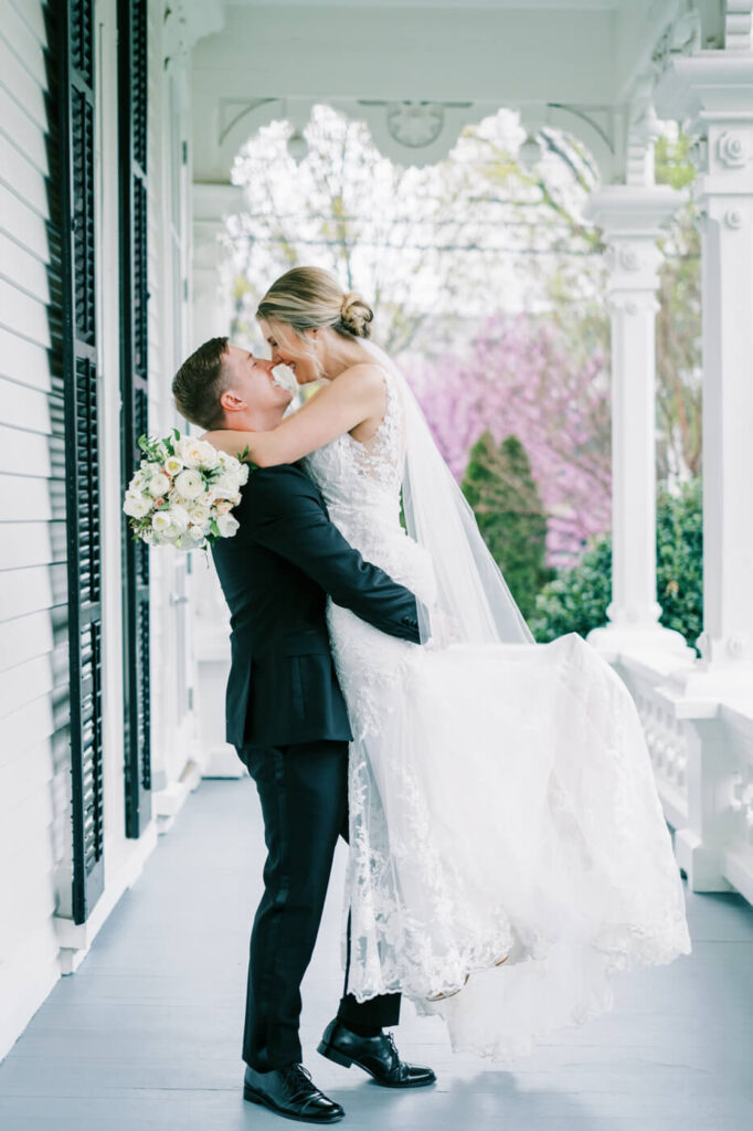 Bride and groom portraits on the Merrimon-Wynne House porch.