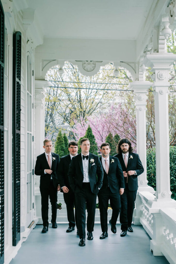 Groom & groomsmen on the Merrimon-Wynne House porch.