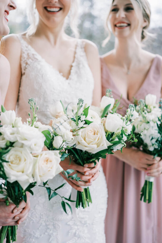 Bride & bridesmaids on the Merrimon-Wynne House porch.