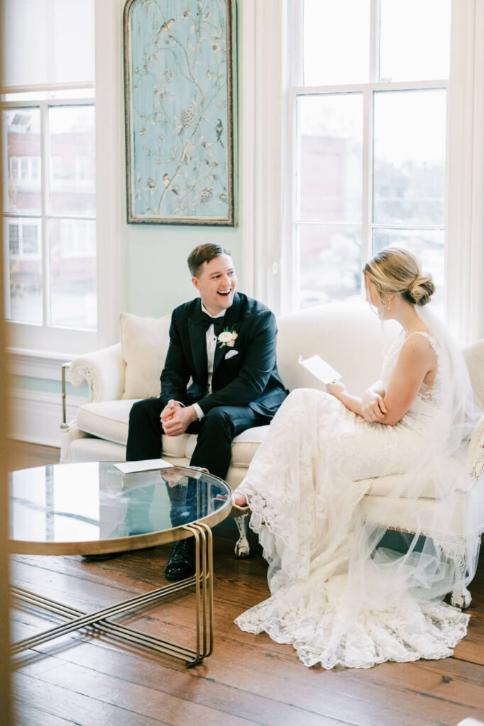 Bride and groom exchanging letters inside the Merrimon-Wynne House