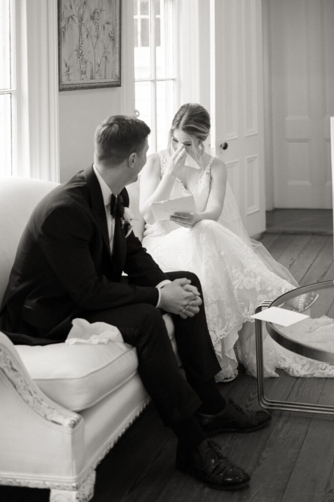 Bride and groom exchanging letters inside the Merrimon-Wynne House