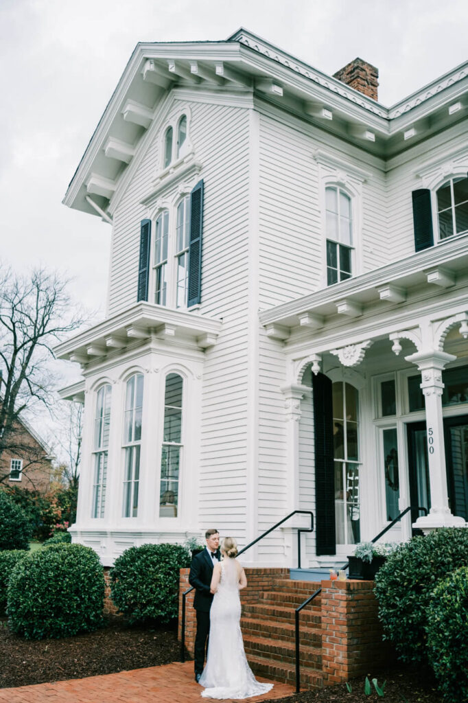 Bride & groom after ceremony outside at Merrimon-Wynne House