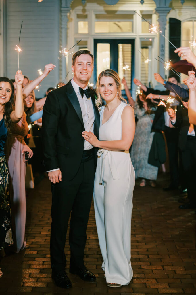 Bride & groom after sparkler exit at Merrimon-Wynne House front steps