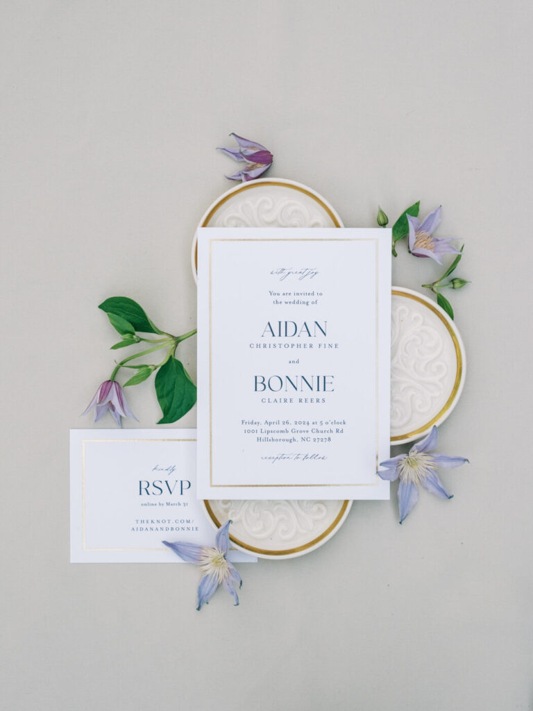 Elegant wedding invitation suite for Bonnie & Aiden's Carolina Grove wedding, styled with delicate florals and textured details.