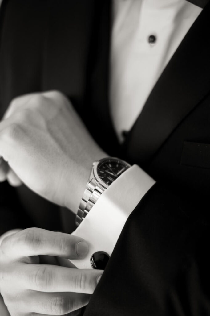 Close-up of groom’s cufflinks and wristwatch, adding a sophisticated touch to his Historic Robertson House wedding attire.