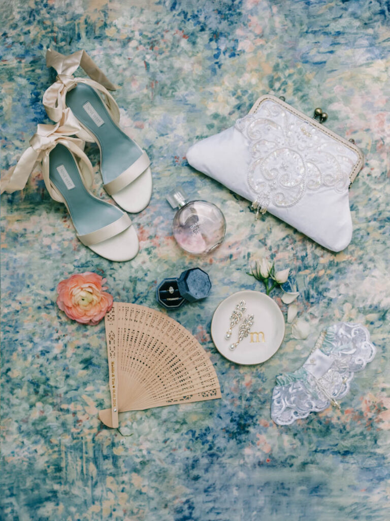 Bridal details for a wedding at Historic Robertson House, including lace garter, heirloom jewelry, and delicate floral accents.